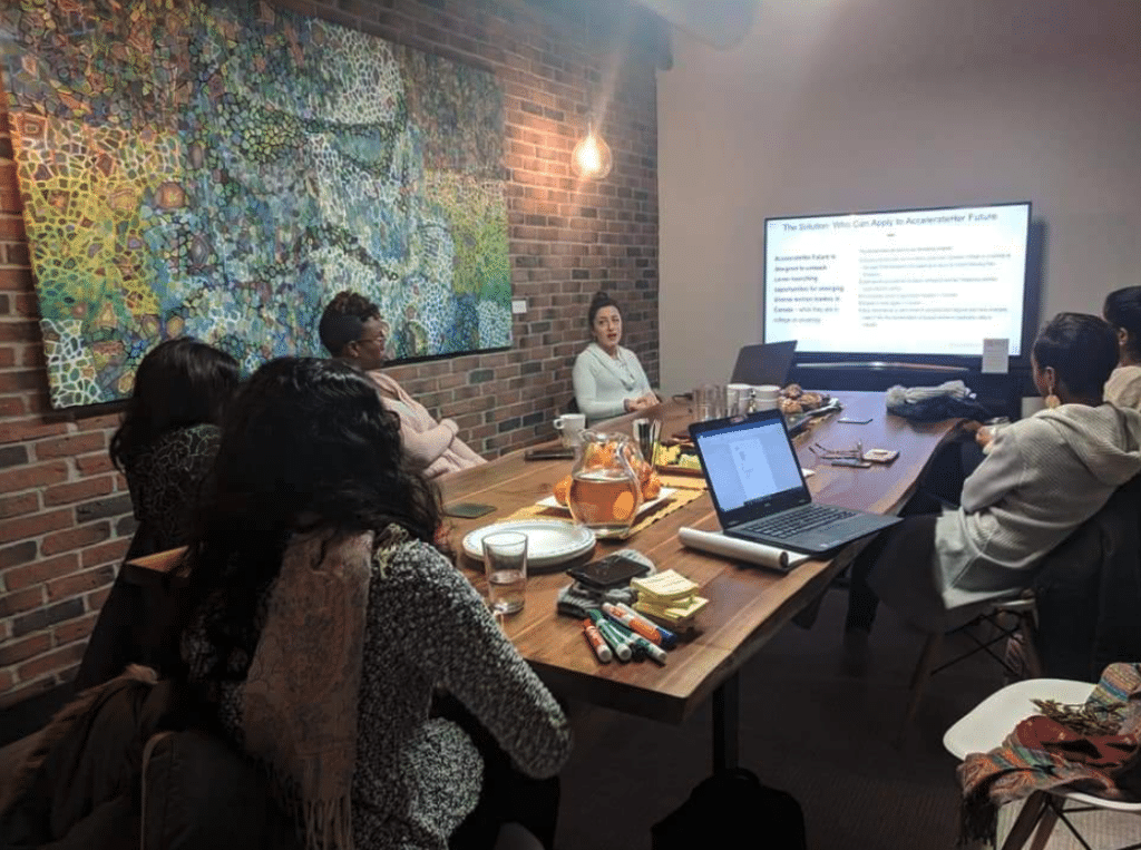 Women sitting around the table working